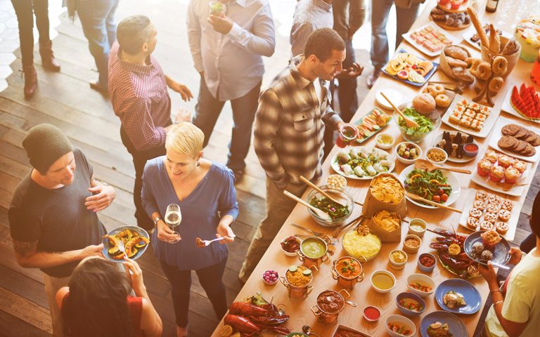 friends talking and eating during party